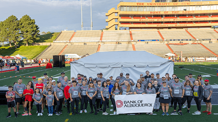 Bank of Albuquerque volunteers attending college football game